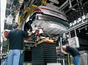 The so-called 'marriage' - half automatic installation of the 7series powertrain in the BMW plant Dingolfing / Germany
